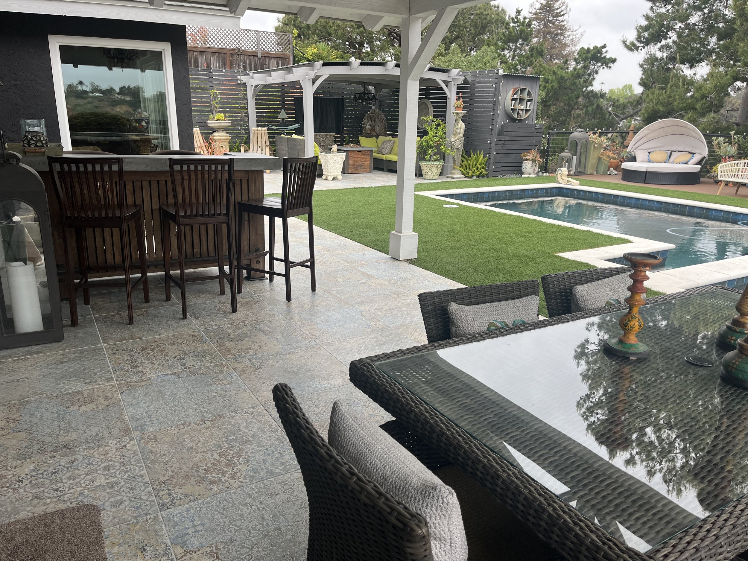 Custom outdoor living space with pool, hardscape and pergola in Oceanside