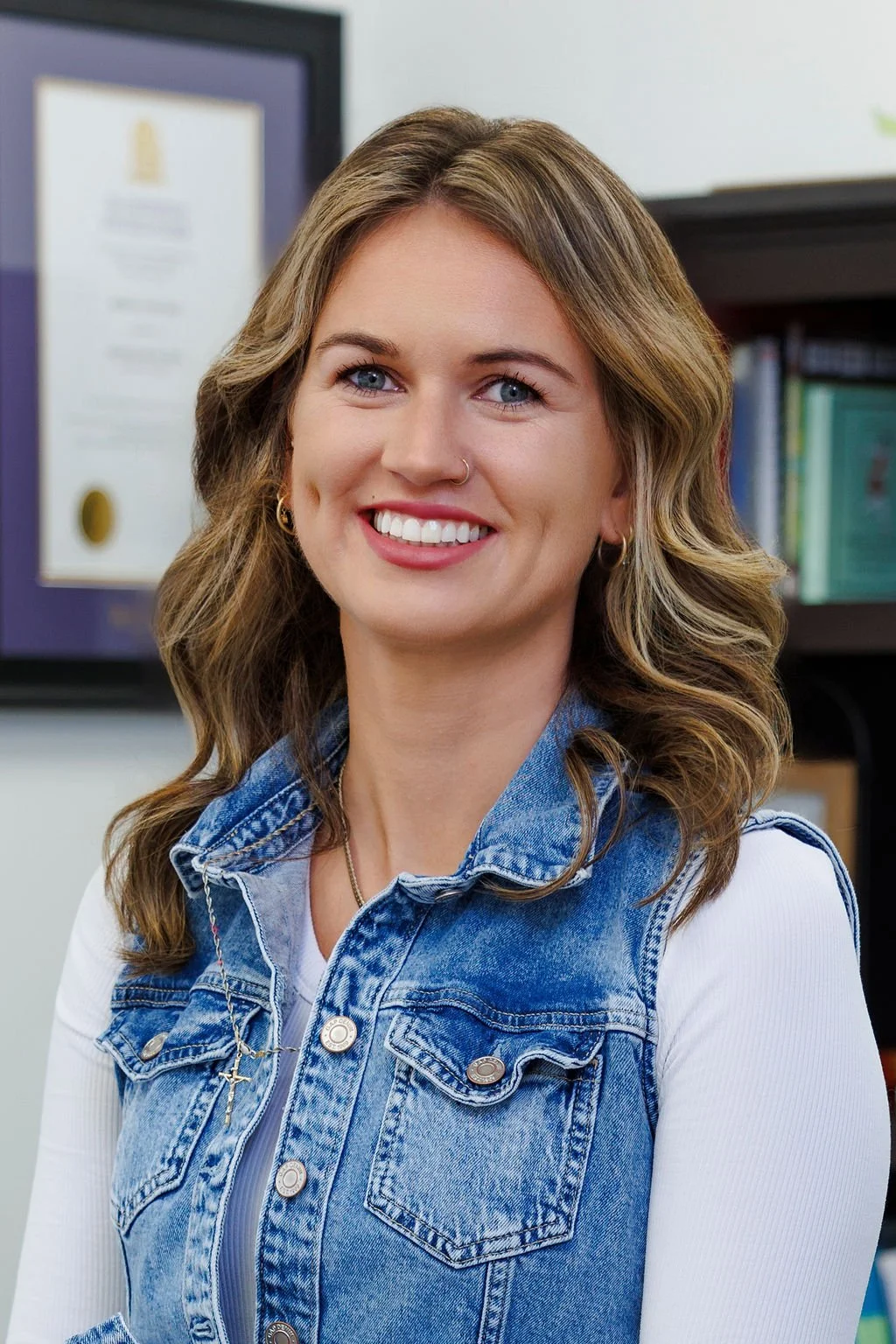 Image of Rebecca Nettleship. She has blonde wavy hair and she is smiling.