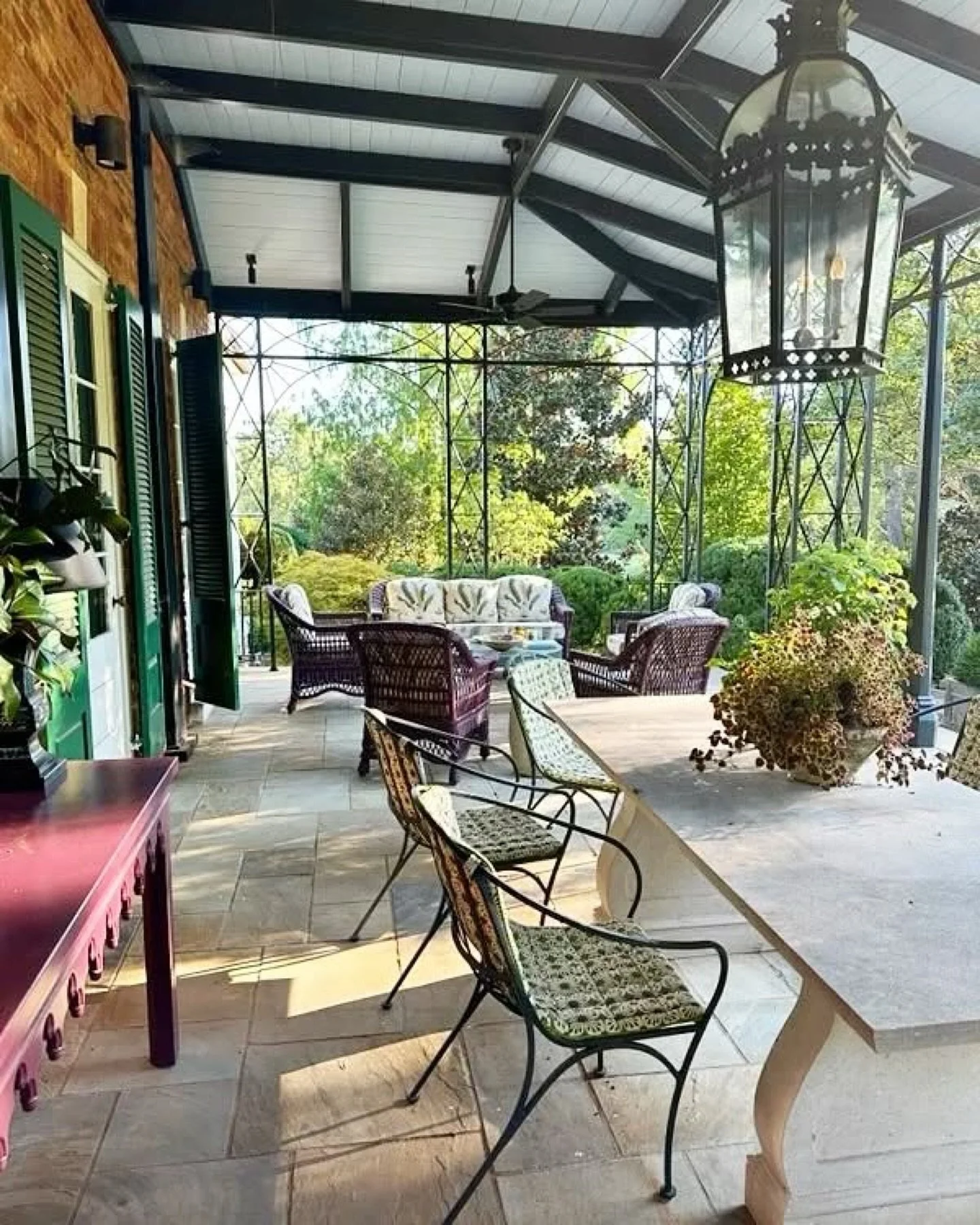 The covered terrace at the home of Keith and Jon Meacham has evolved from a patch of grass to an open terrace and now to this beautiful old Nashville-style covered porch designed by @benpagelandscape, who designed the lush landscape as well. The furn