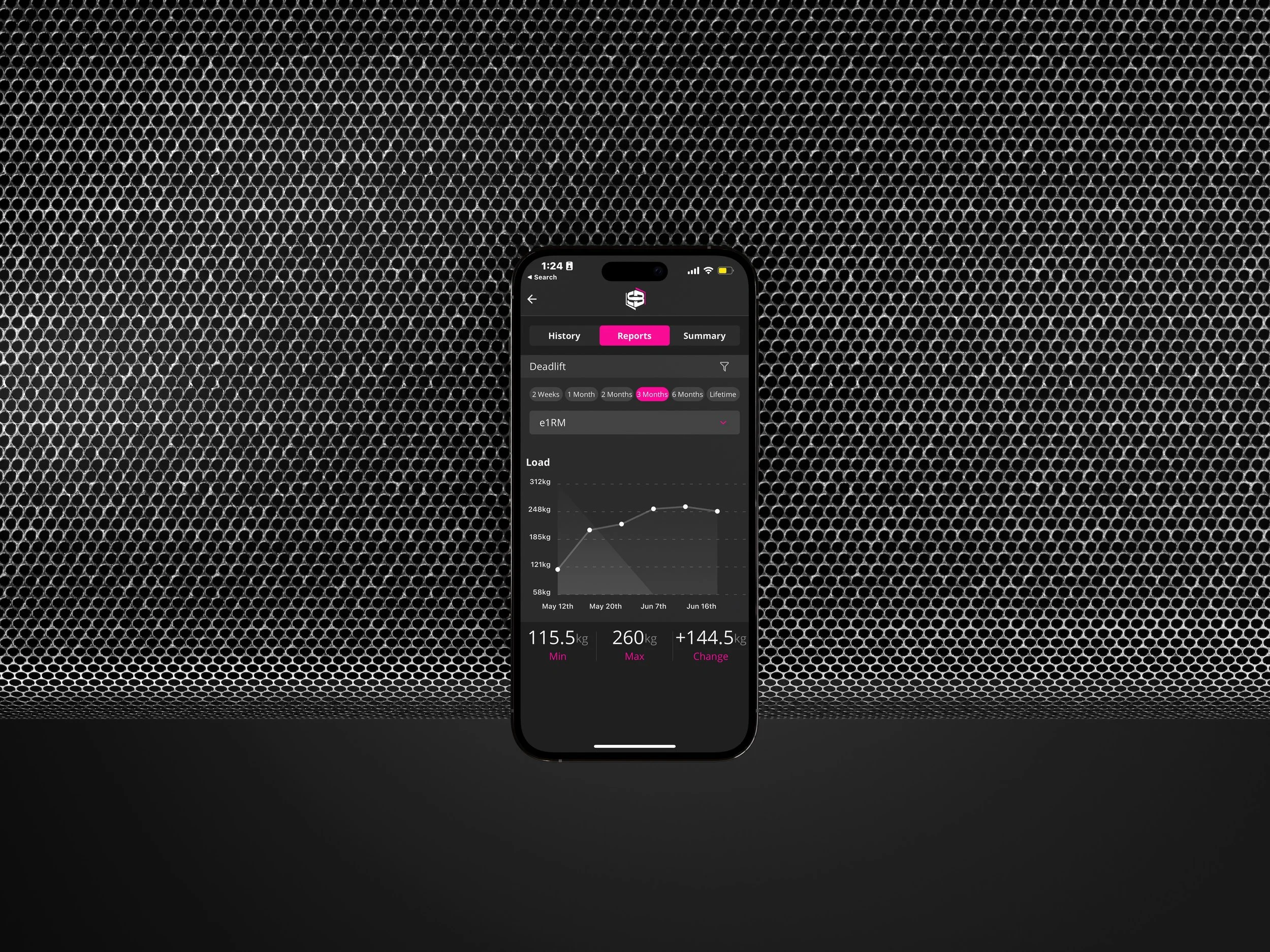 Smartphone displaying fitness tracking app with workout progress graphs and statistics, mounted on a textured black backdrop.