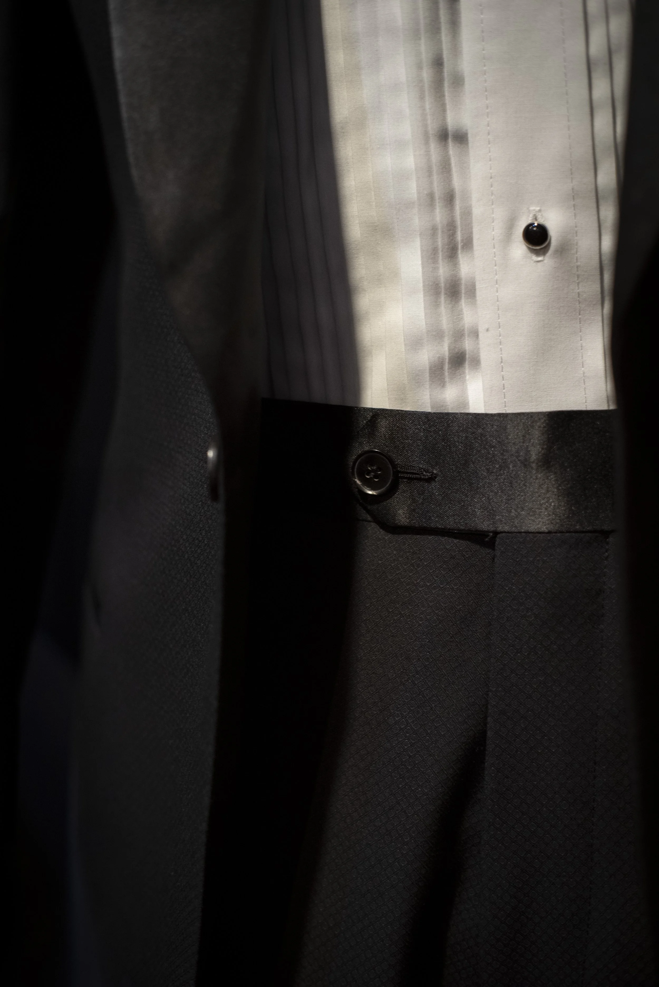 Bespoke tuxedo by 1942 Clothiers in West Ybor, Tampa, Florida. Satin finished waistband.