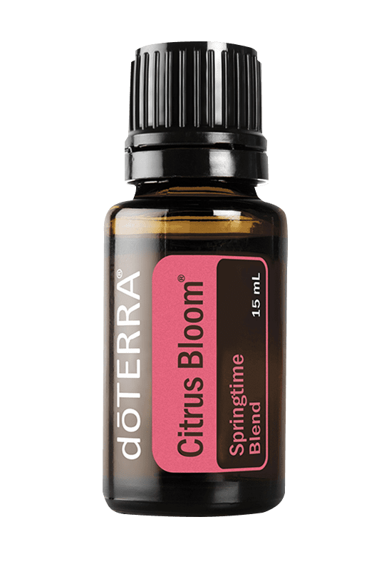 Small brown glass bottle with a black screw cap, labeled dōTERRA Citrus Bloom Springtime Blend essential oil, 15 mL