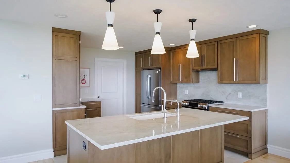 Our Suttons Bay kitchen remodel exudes warmth with its natural wood tones and a soft neutral palette. 

#kitchenremodel #remodel #nestindesign #interiordesigner #traversecityinteriordesigner #michiganinteriordesigner #newkitchen #homeremodel