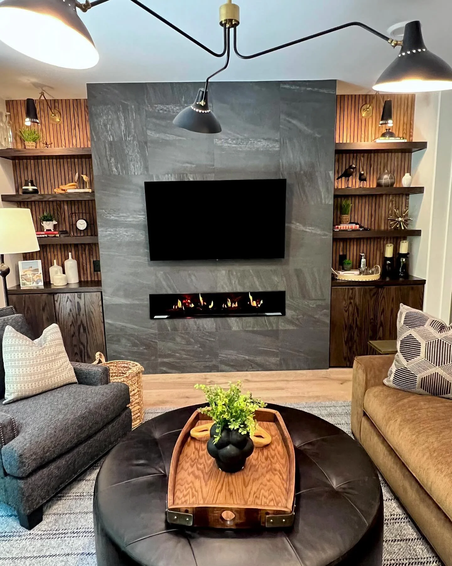 Who says an electric fireplace can&rsquo;t be cool? Not us! 

#electricfireplace #cozy #bachelorslivingroom #interiordesign #traversecityinteriordesigner #nestindesign #nestofgt #nomiinteriordesign #michiganinteriordesigner