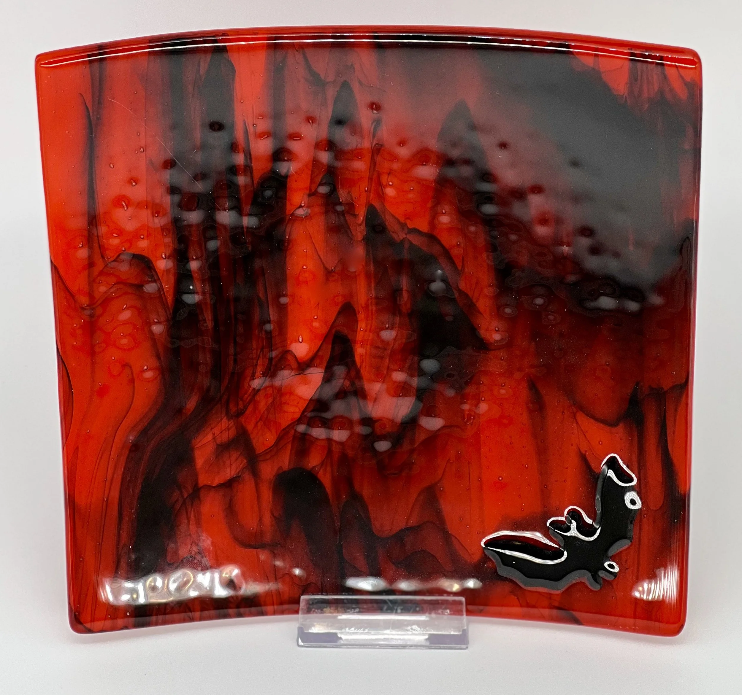 Pimento Red with Clear and Black Streaky overlay.  Bat - 8.5" square $55.