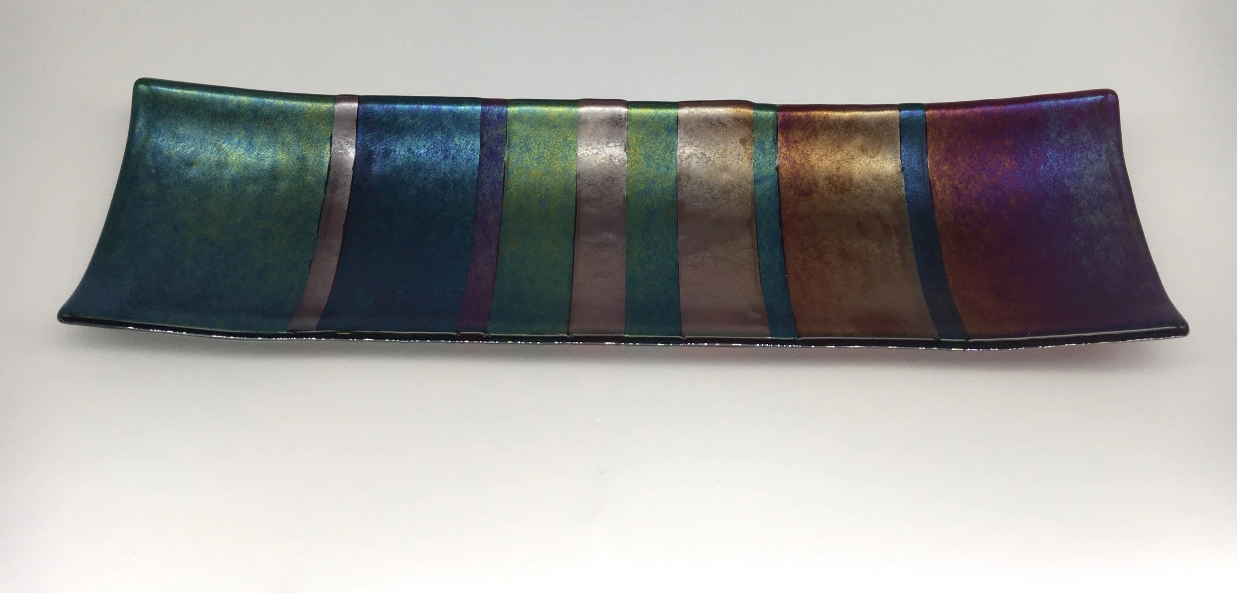 Transparent Red and Transparent Aventurine Green glass with rainbow iridescent coating.  Fibonacci style 15.75" x 4.5". $75 - SOLD