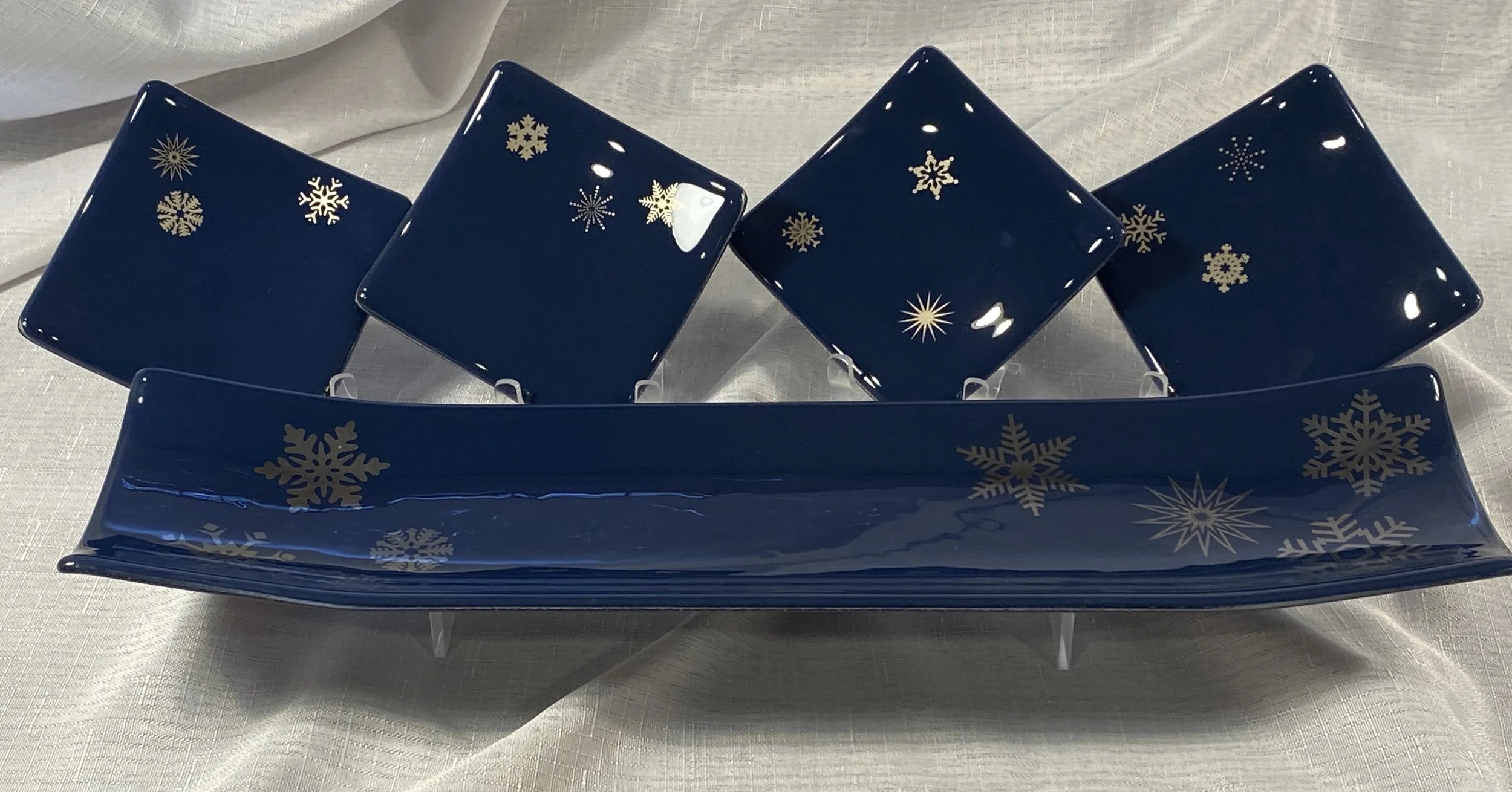 5 piece set - indigo blue with platinum snowflake pattern  $135. Channel platter is 17"x 4.5". appetizer plates ate 4.5" square