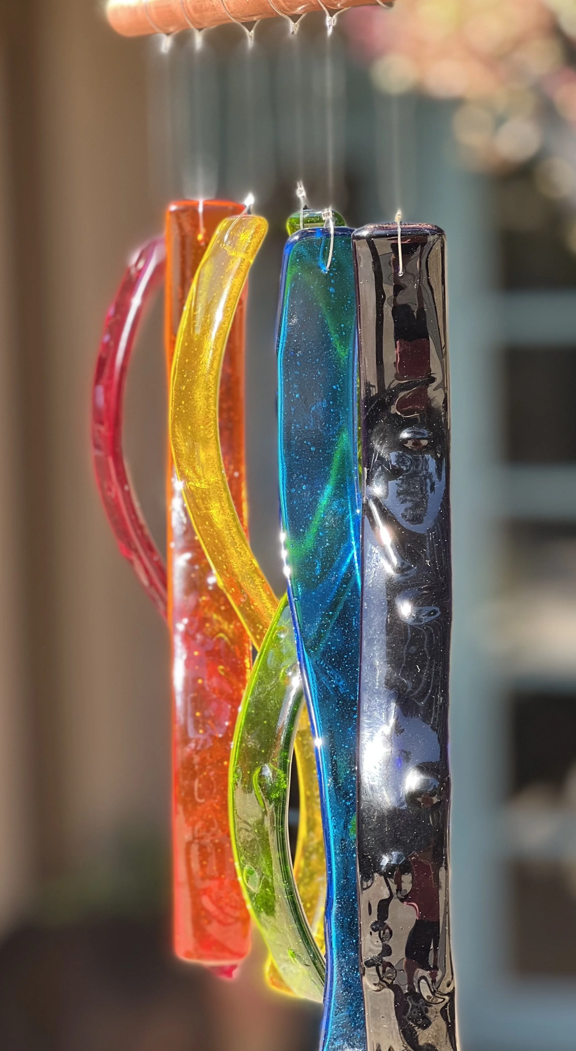 Rainbow colors - each strip is approximately 10" long, and all hang from a 7" copper pipe.