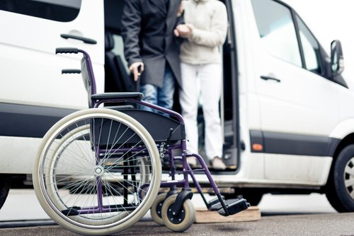 nurse-assisting-senior-man-out-of-van.jpeg