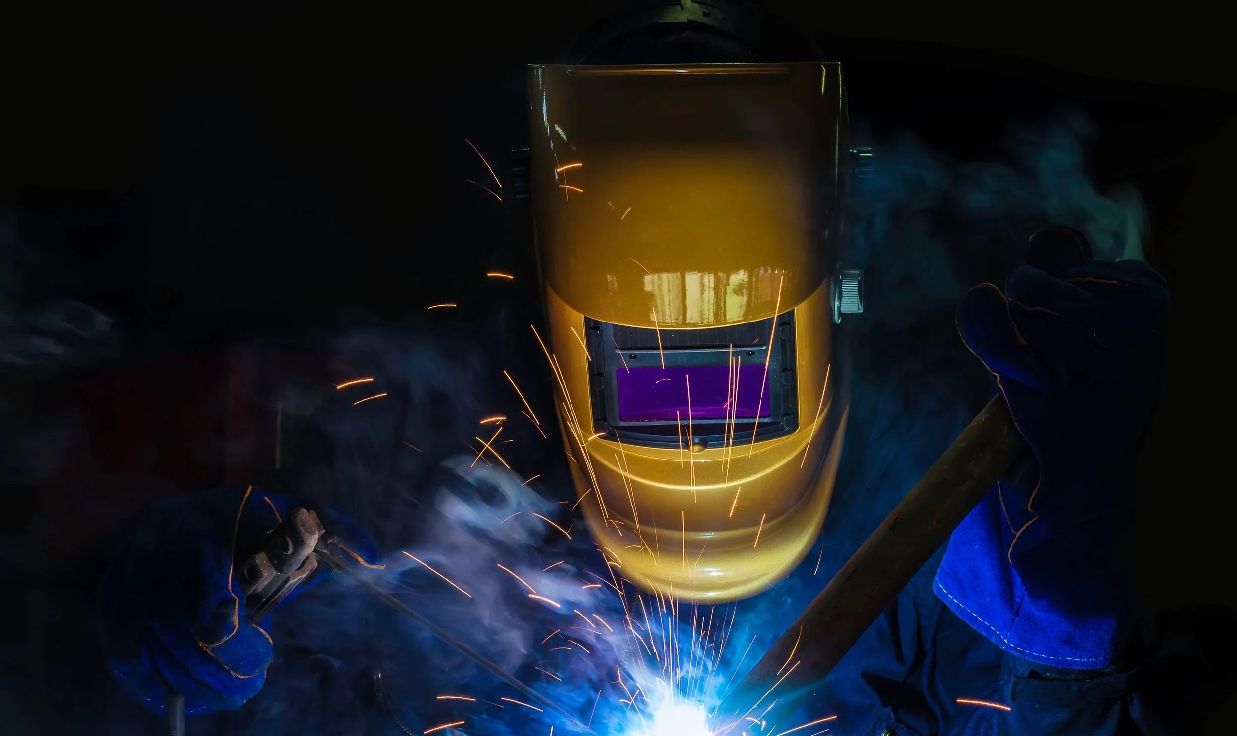 Image of blacksmith welding a structure
