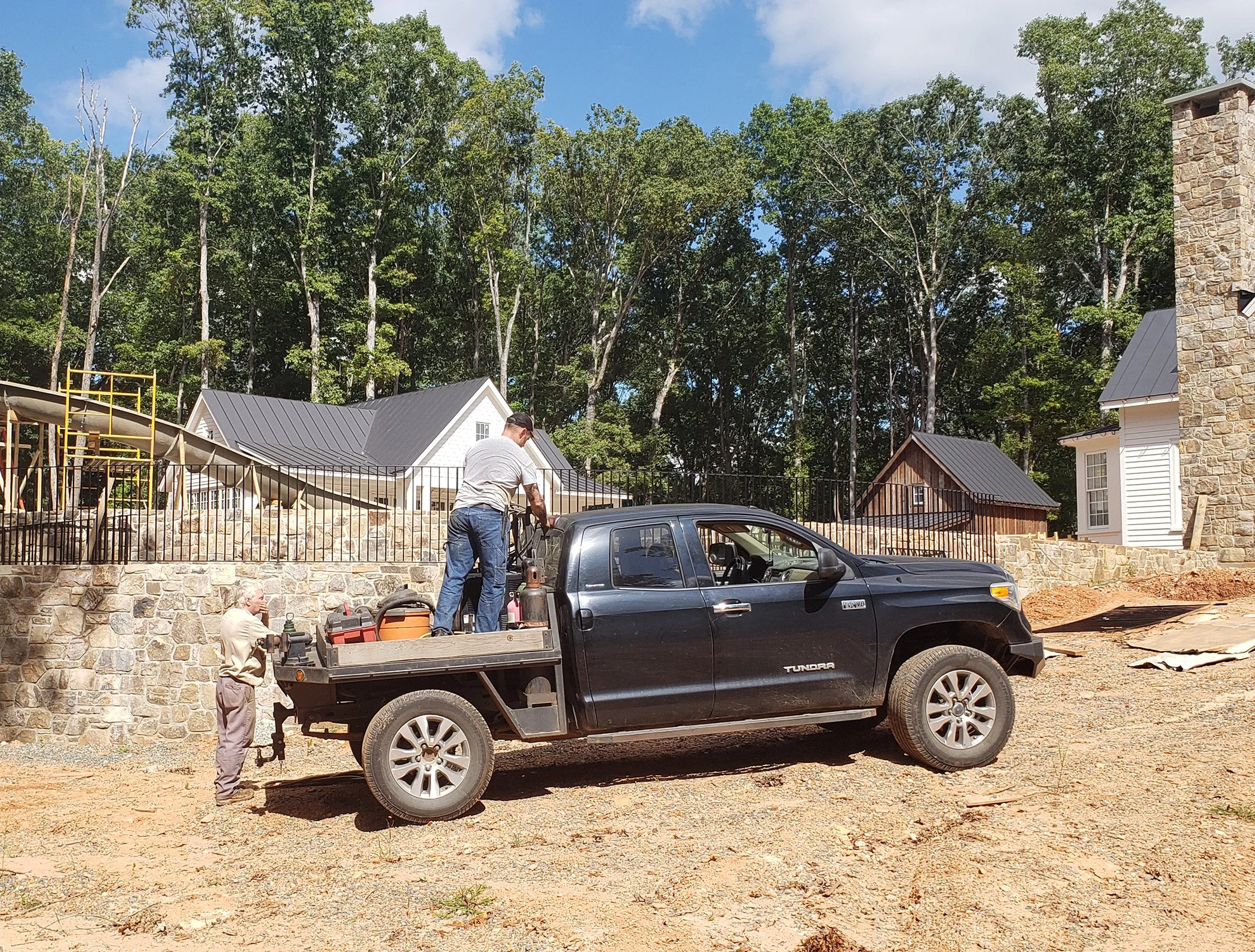 Photo of T5 Plus Welding truck and team on the job installing a fence around a pool
