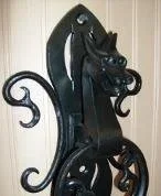 Ornamental wrought iron dragon door knocker
