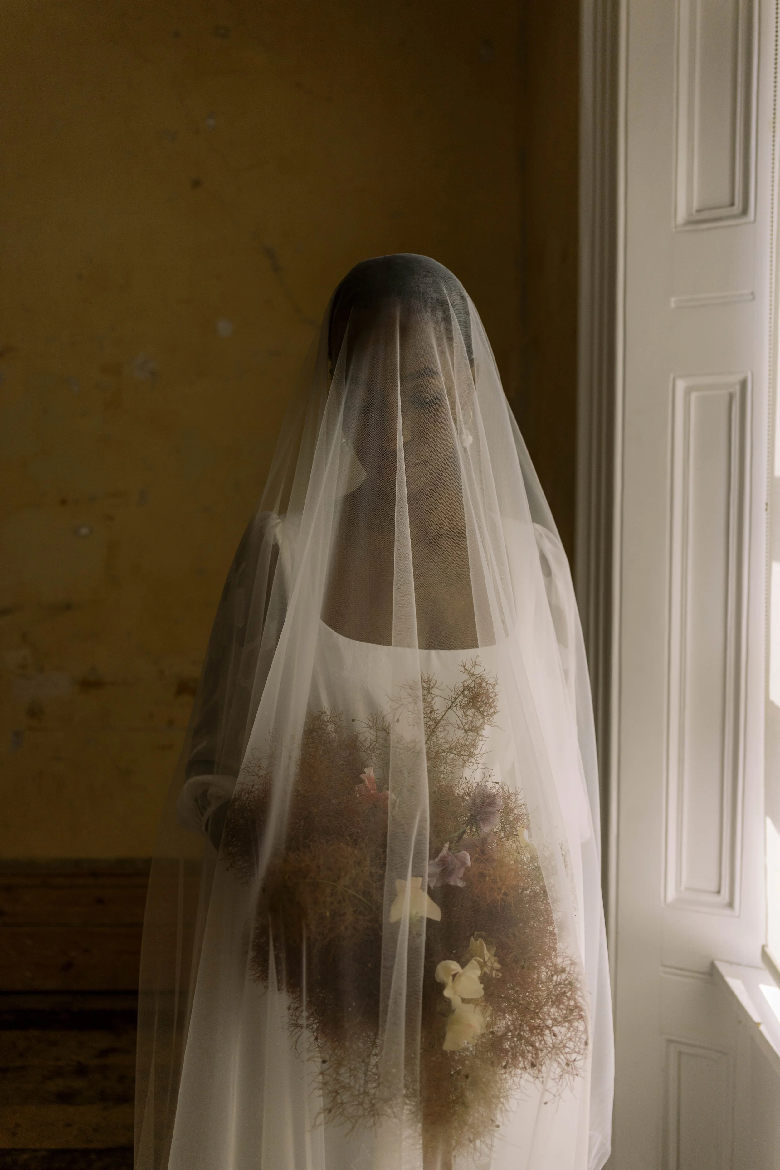 Smokebush bridal bouquet by Darcey Floralscapes and a bride in a Shikoba Bride gown