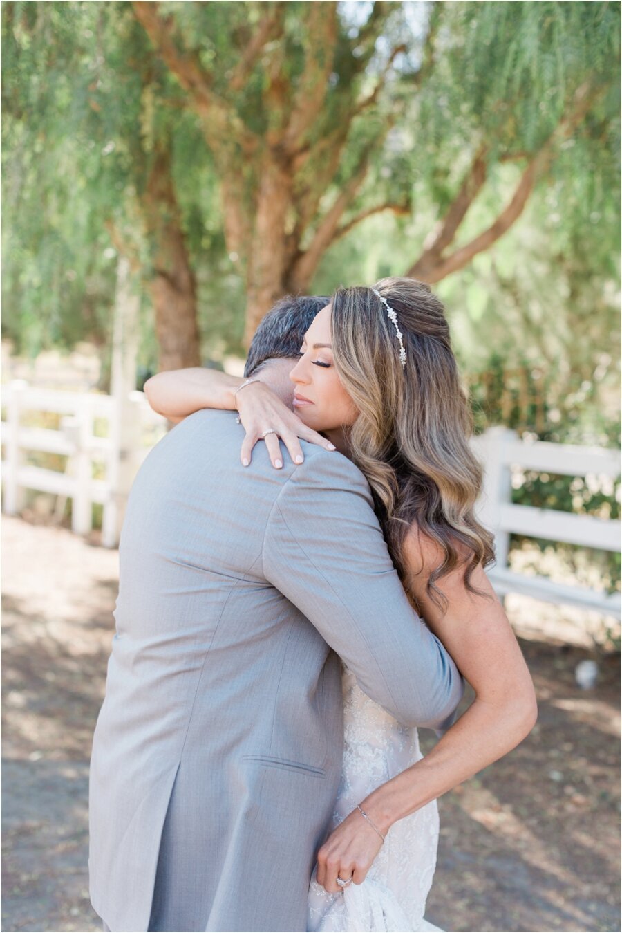 Bride hugs her father after their first look