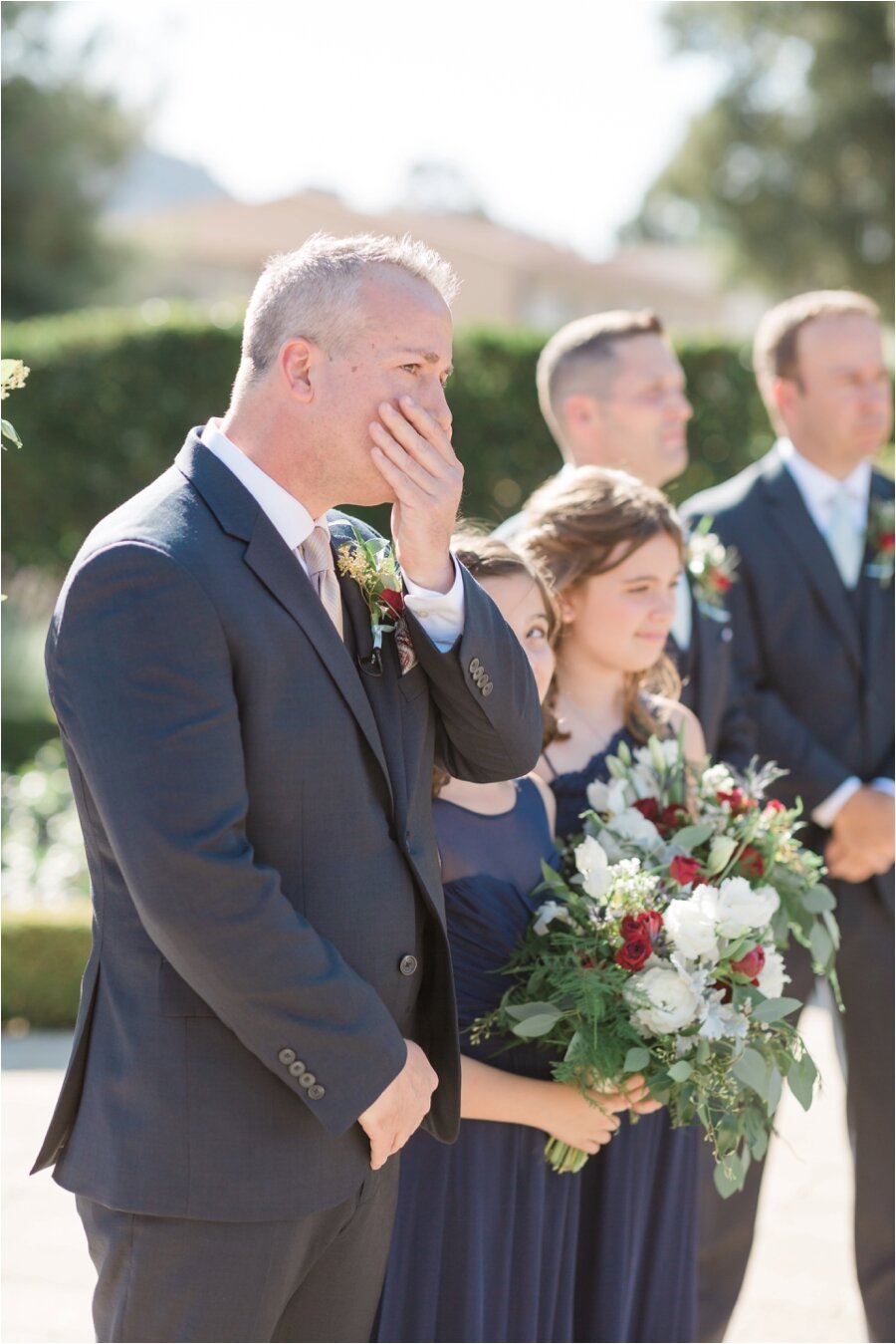 Grooms reaction when he sees his bride walking down the aisle