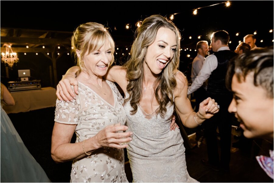 bride dances with her mother at wedding reception