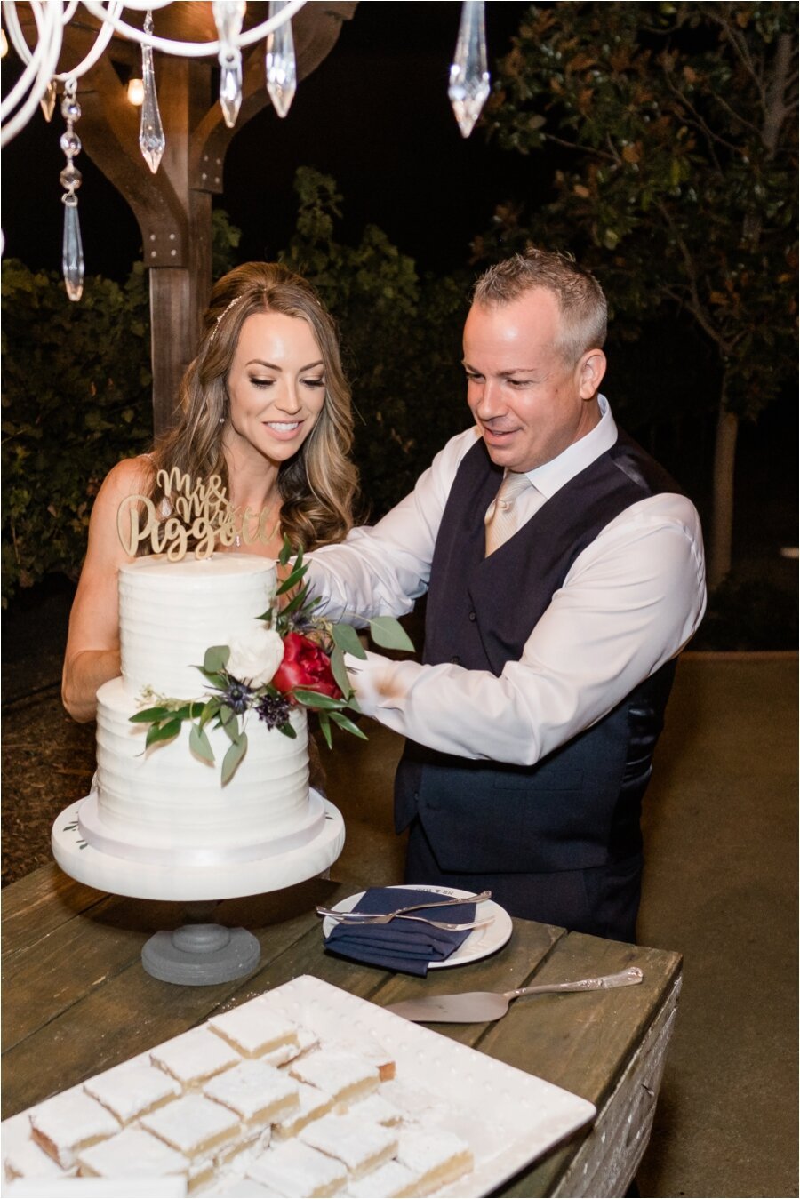 bride and groom cut the cake