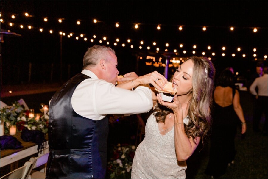 bride and groom eat their Chicago style hot dogs