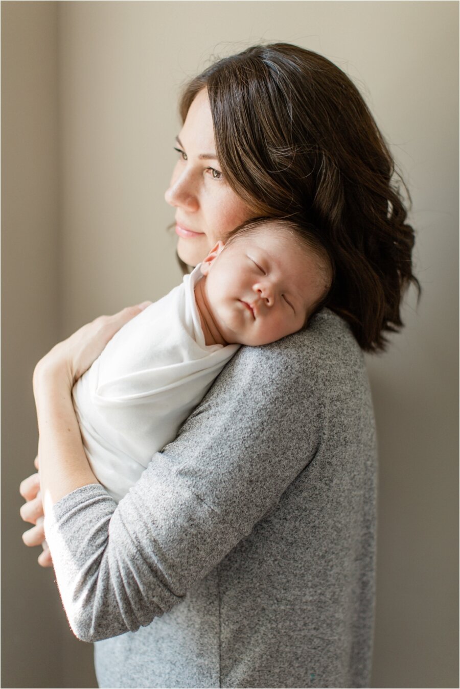 portrait of mother with her newborn baby