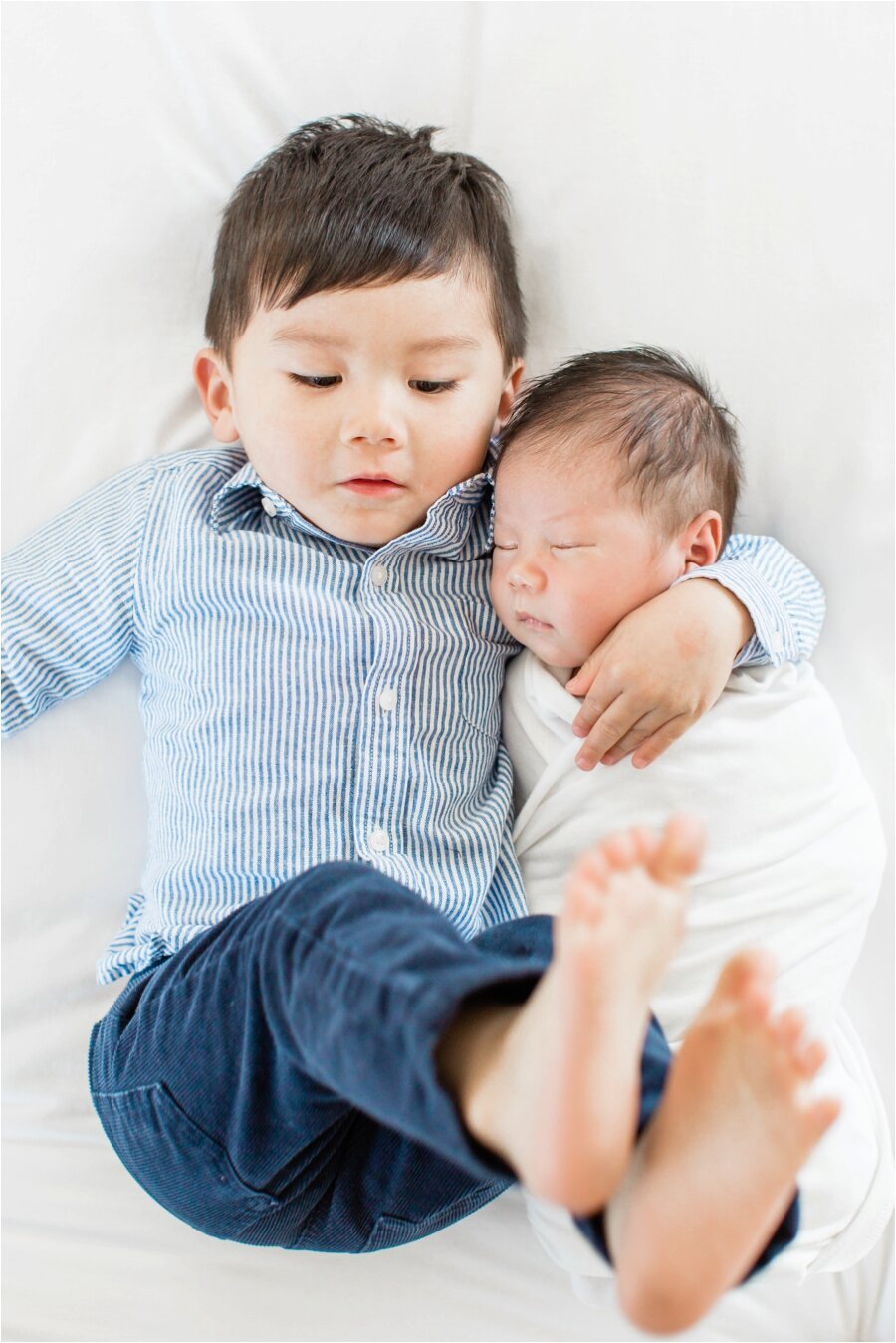 newborn baby brother and big brother