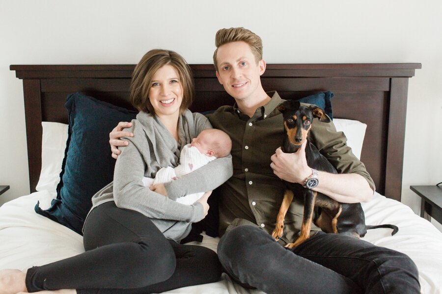 family portrait with newborn and dog