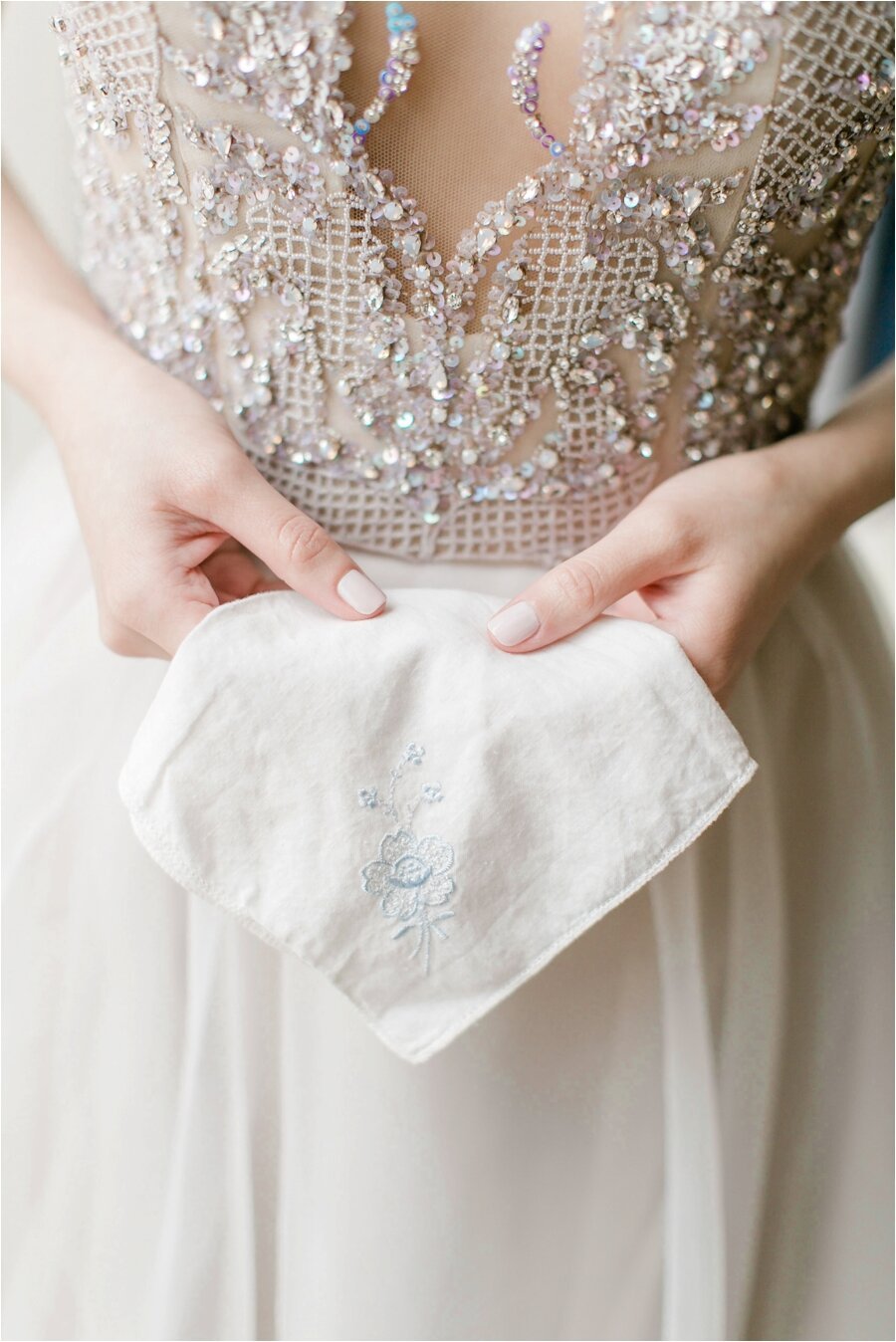 close up of bride holding heirloom handkerchief