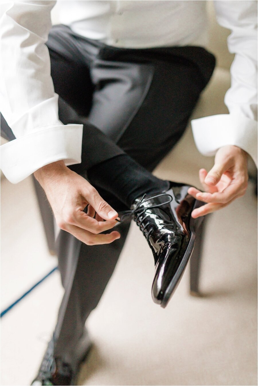 groom putting on his shoes