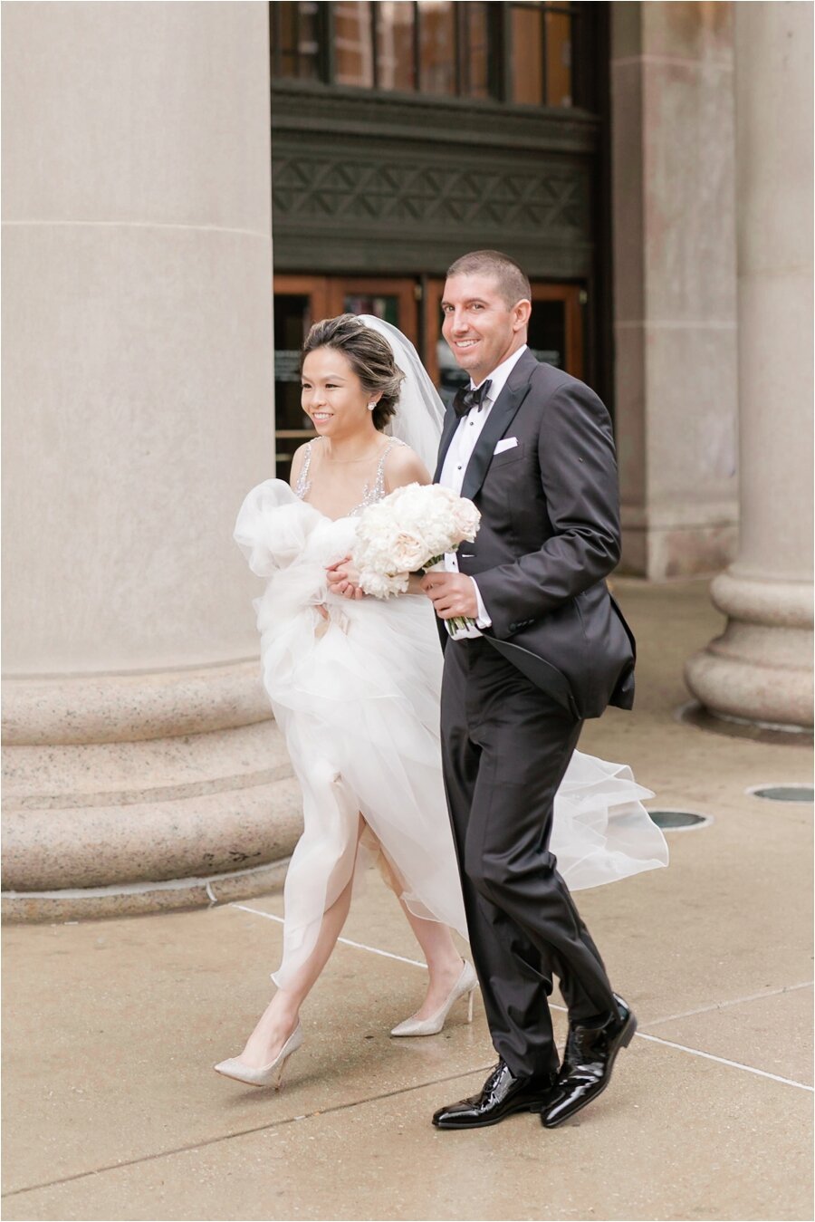 bride and groom walking at Chicago Union Station 