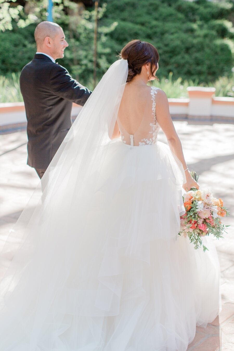 bride and groom walk away together 