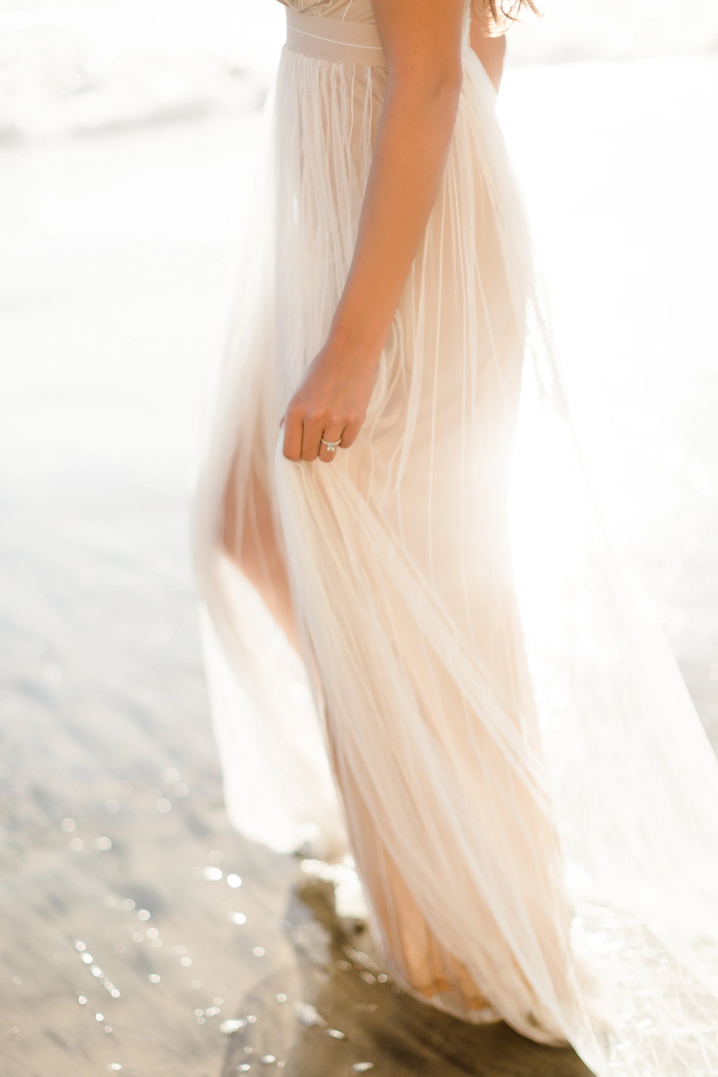 I overexposed the shadows on my subject in this image to counteract the harsh sun in the background. However, you can still see the detail in the highlights surrounding her…especially in her dress.
