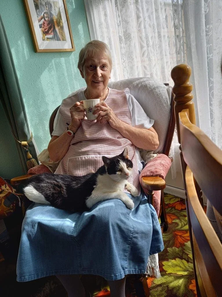 Older lady with her cat.