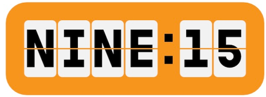 Digital clock displaying 9:15 with an orange background.