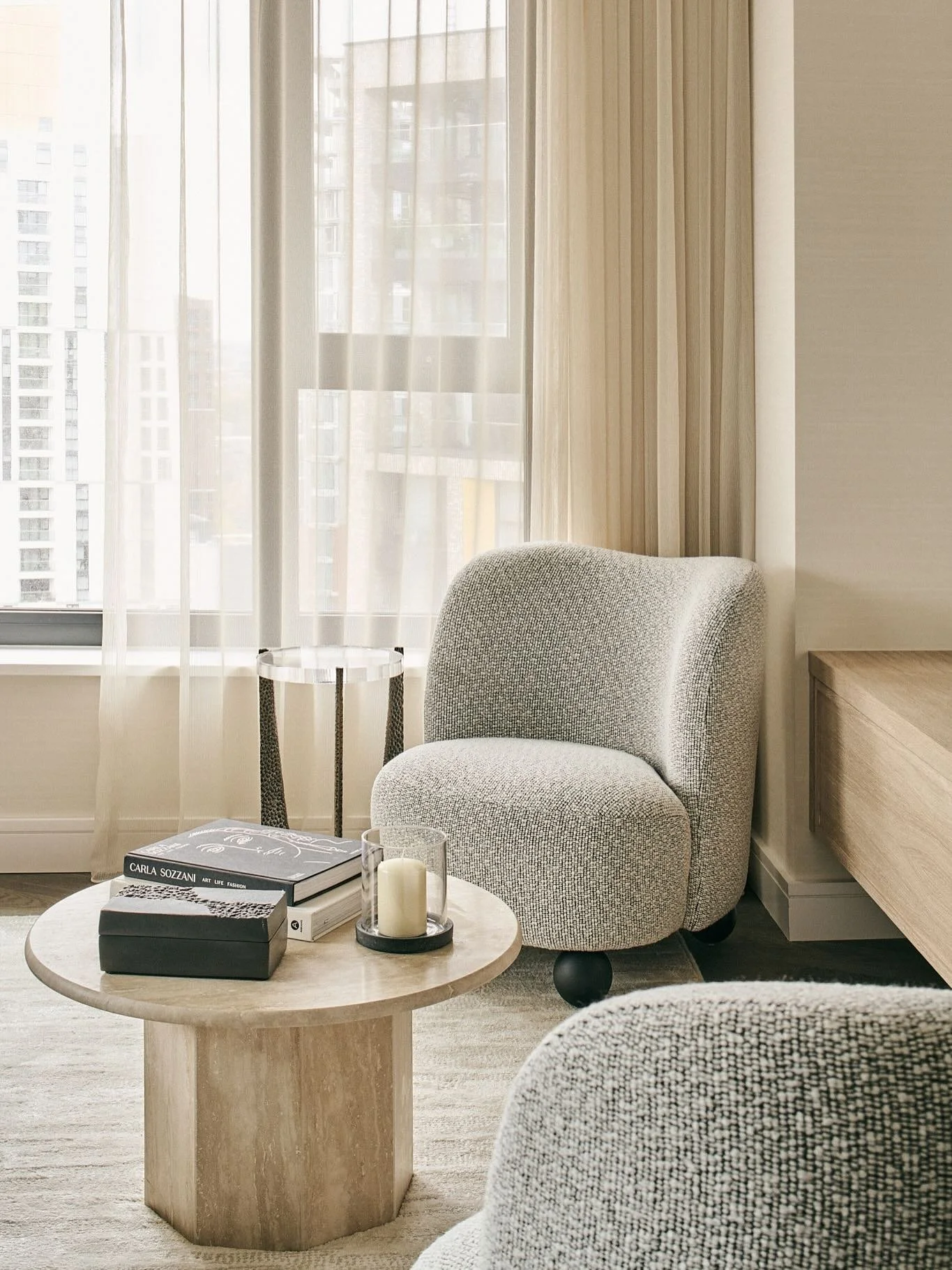 The real show stopper in the living space at our Nine Elms project is the bespoke wall-hung TV unit. Its curved front and warm wood grain are balanced with brass shelving, giving the piece a strong sense of craftsmanship and individuality. Acting as 