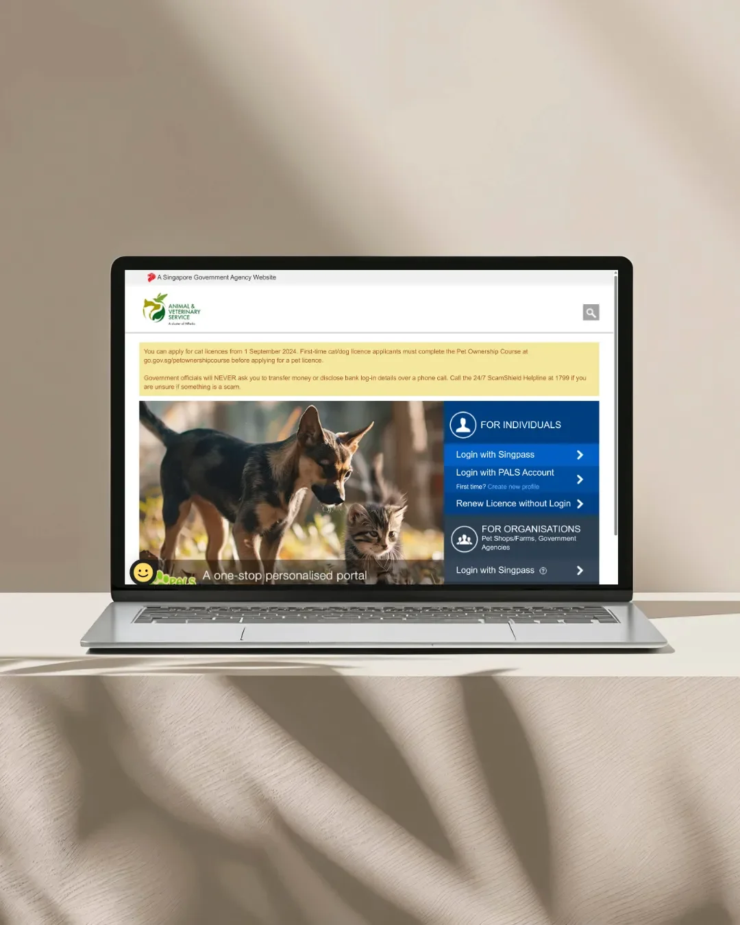 A laptop showing the AVS PALS website, where new owners complete the pet ownership course.