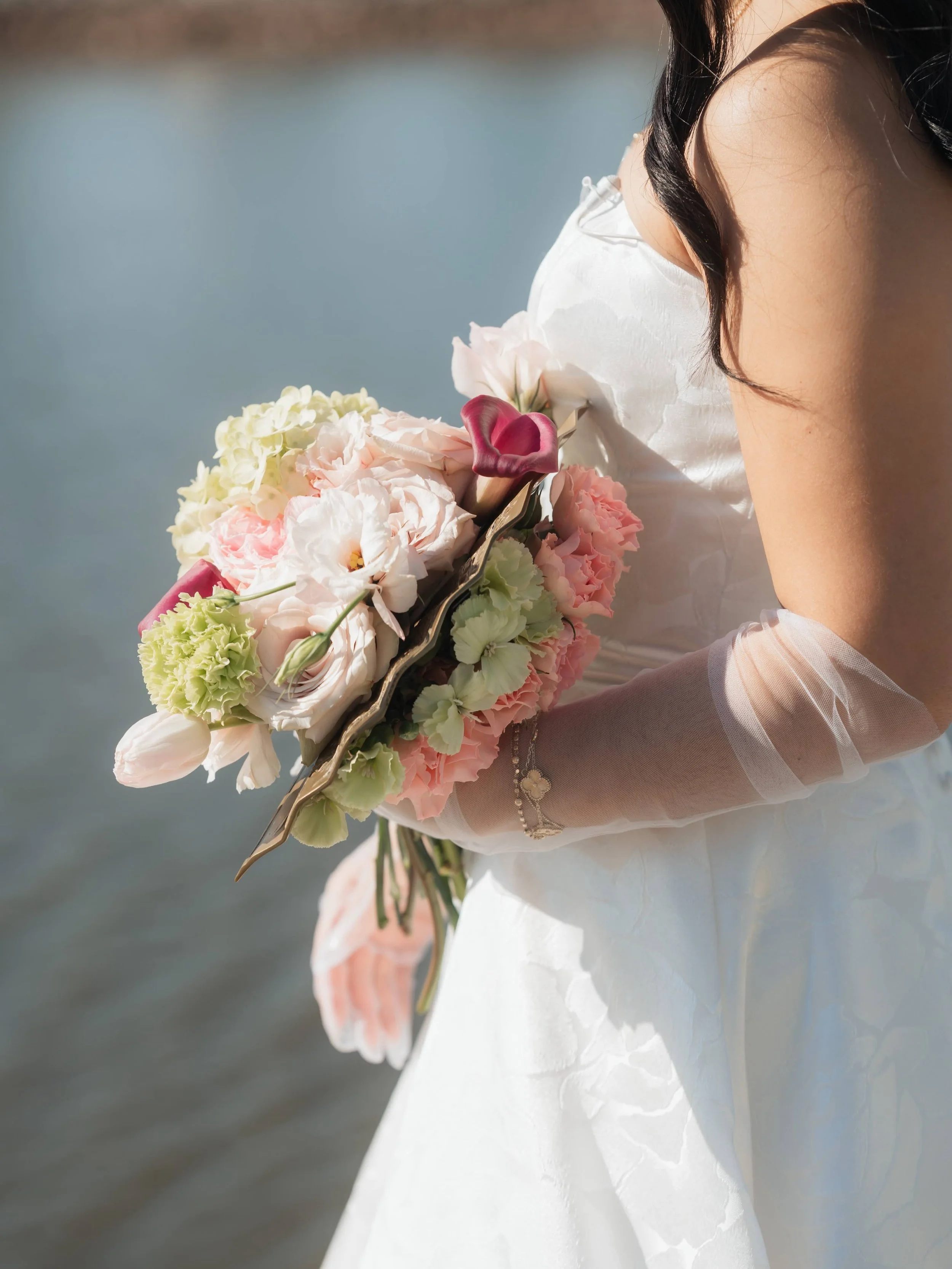 A bridal bouquet wrapped around a precious family heirloom. It was such an honor to be part of Yvonne &amp; Tommy&rsquo;s special day and help bring a piece of family history into their wedding story. 💗

Planning: @summerof90weddings 
Venue: UCO Boa