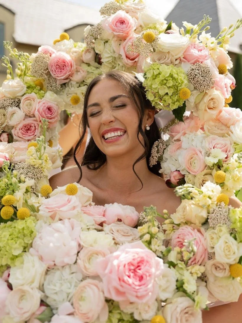 Soft blush, creamy ivories, fresh greens, and a pop of sunny yellow&mdash;a floral palette as radiant and joyful as the bride herself! 🌸💛

Bride: @madigracemathis 
Photo: @saraelizphotography_ 
Venue: @thebowervenue 
Planner: @embellishedweddings @