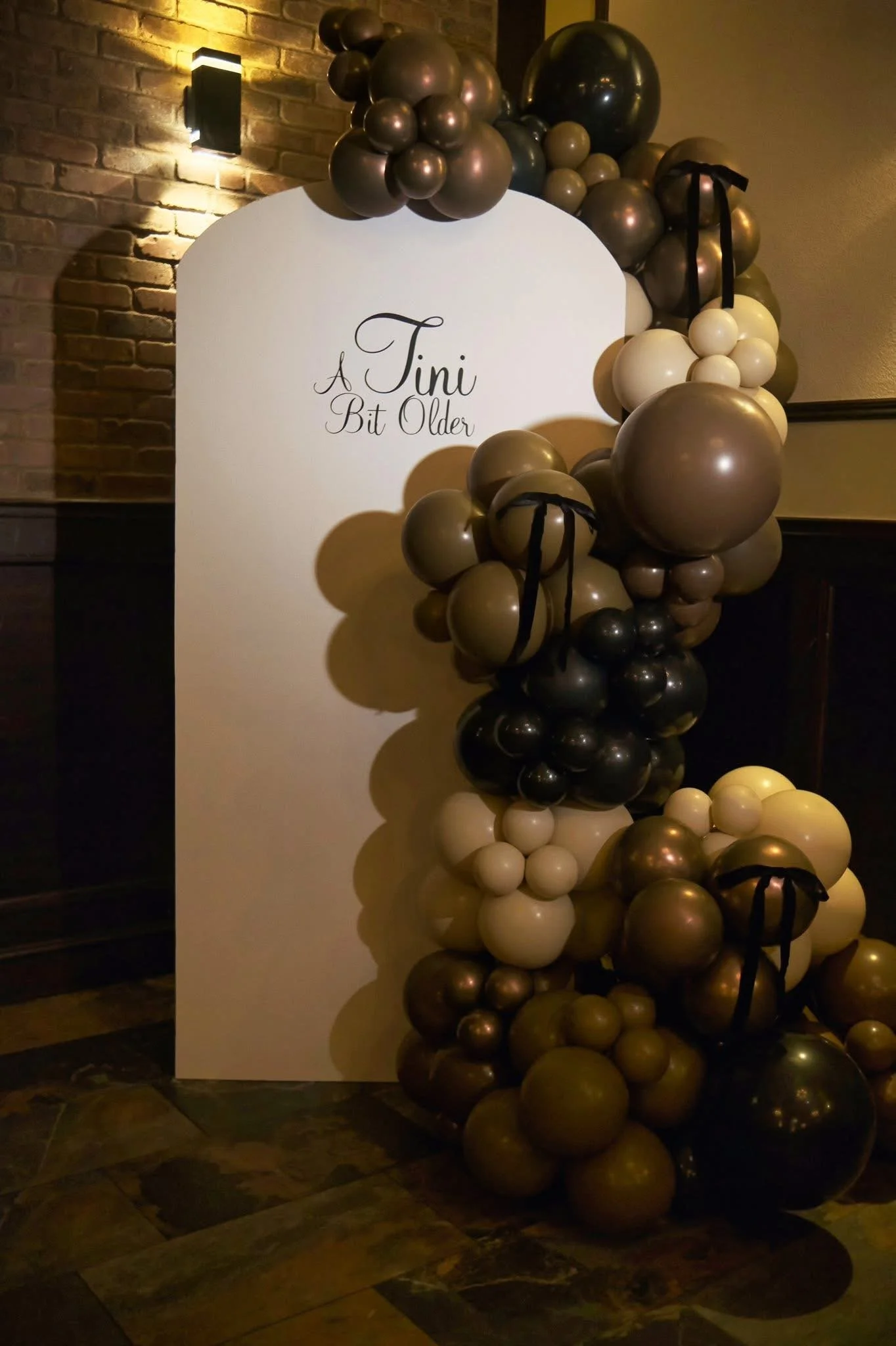 tini bit older bithday, balloons, balloon garland balloon arch, martini theme, milestone birthday, birthday, balloon