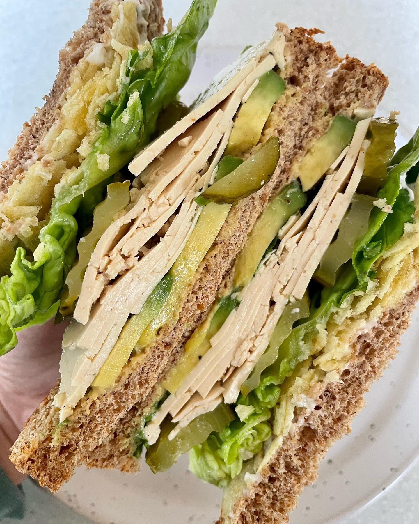 Giant sandwich inspired by @schoolnightvegan 🤩 with avocado, tofu, pickles, lettuce, crisps (!), mustard &amp; vegan mayo on wholemeal bread 🥪