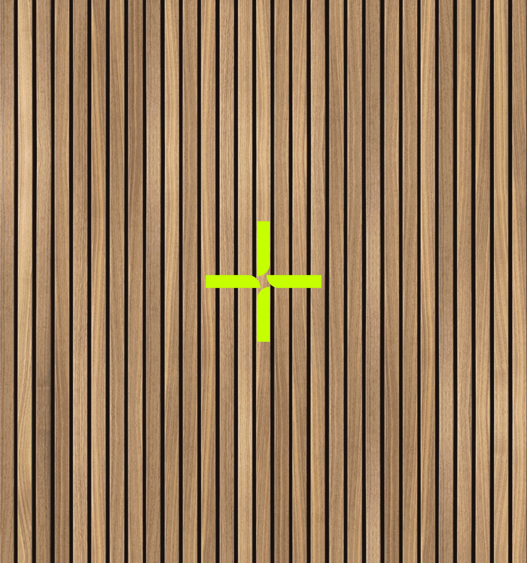 A wooden surface with a yellow cross marking at the center.
