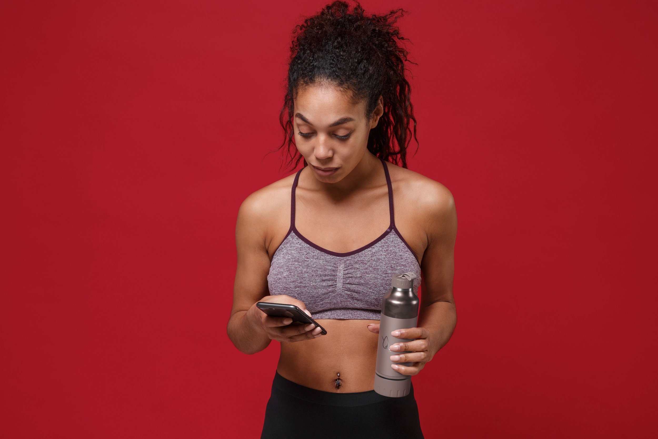 AquaTech Context Render_Woman Looking at Phone_Cinnamon.jpg