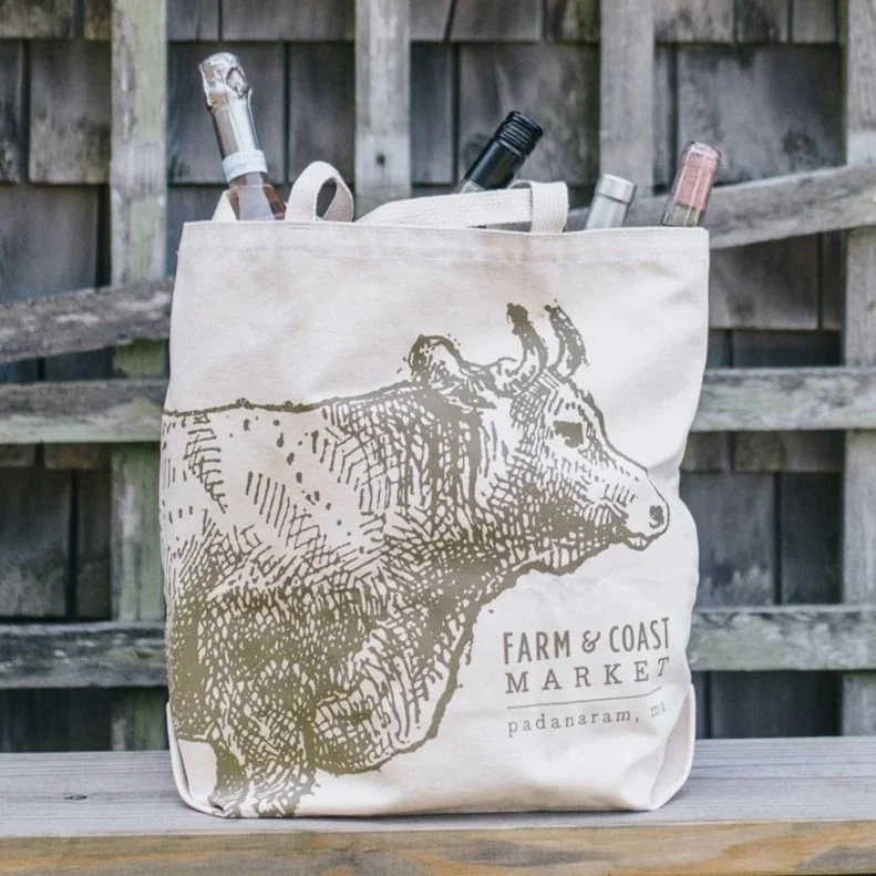 A tote bag with a cow on it
