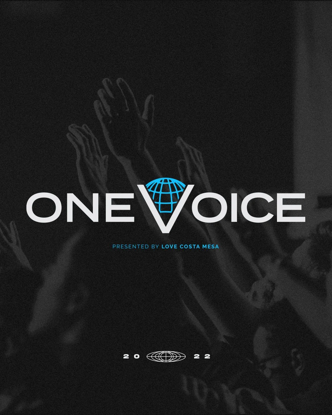 Event poster titled 'One Voice' presented by Love Costa Mesa, with a dark background and hands raised, featuring a globe logo with a V in the center, and the year 2022 at the bottom.