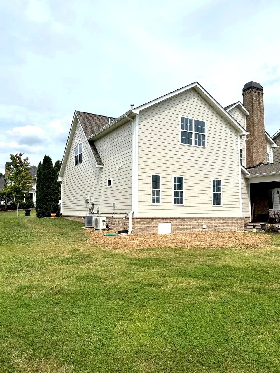 New home addition in Chattanooga TN designed and built by VMH Construction with brick foundation and Hardie siding.