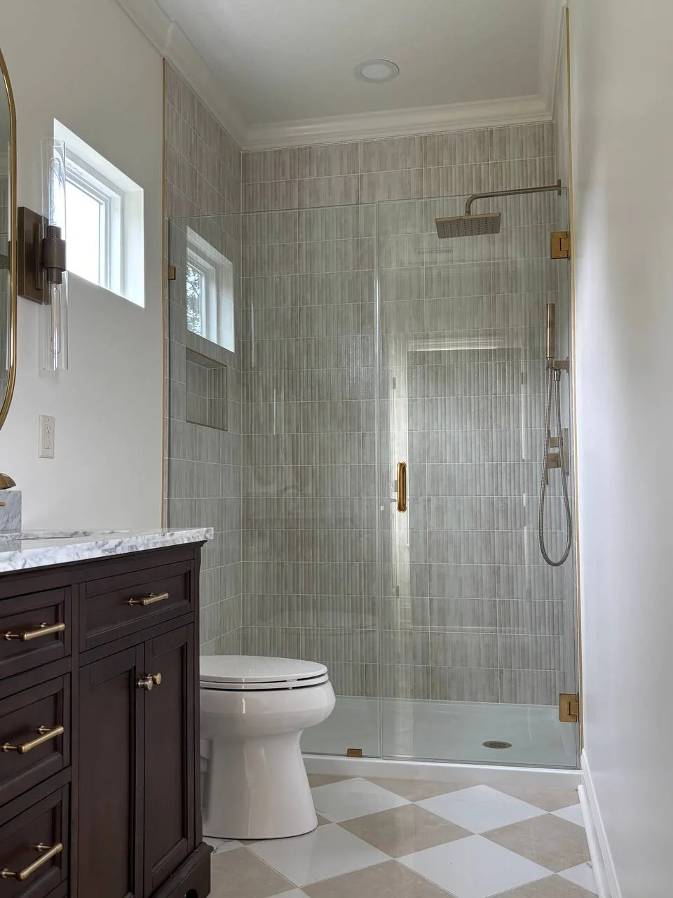 Frameless glass shower with modern tile surround in custom home addition bathroom in Chattanooga TN.