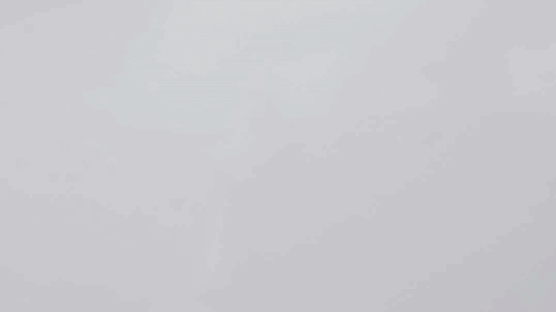Empty white space with some faint marks or light smudges.