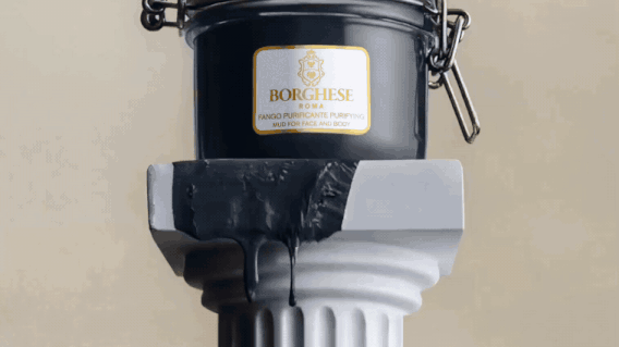 A black container labeled 'Borghese Fango Purificate Purifying Mud for Face and Body' sits on a white pedestal with black wax or mud dripping from its side.