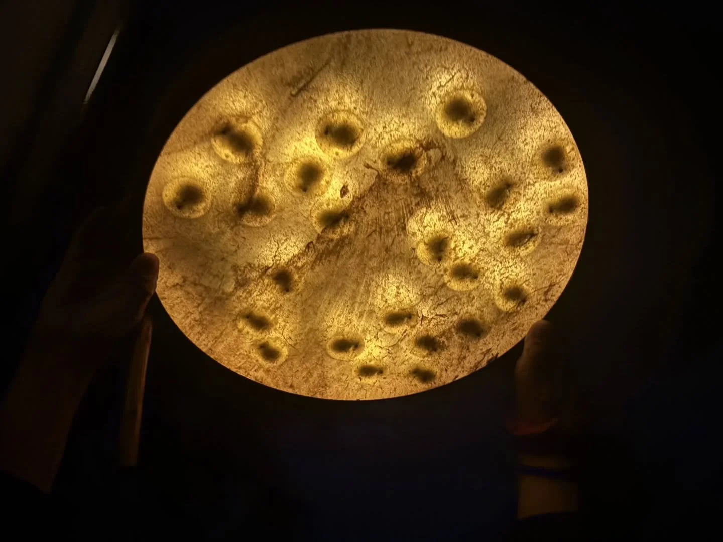 Candlelit drum under a full Harvest Moon.