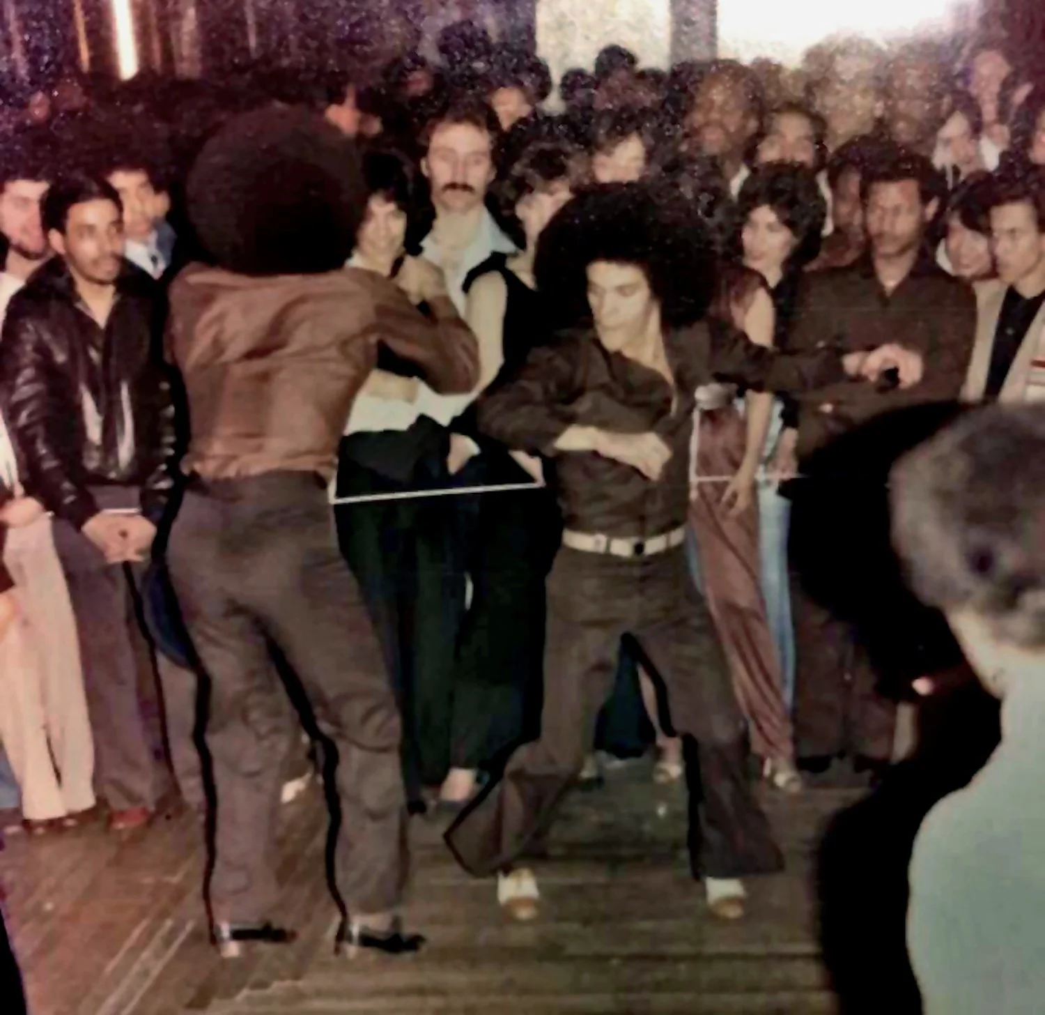 Lucky and Vinny face off in a Rock contest, late 1970s. Courtesy of Willie Estrada.