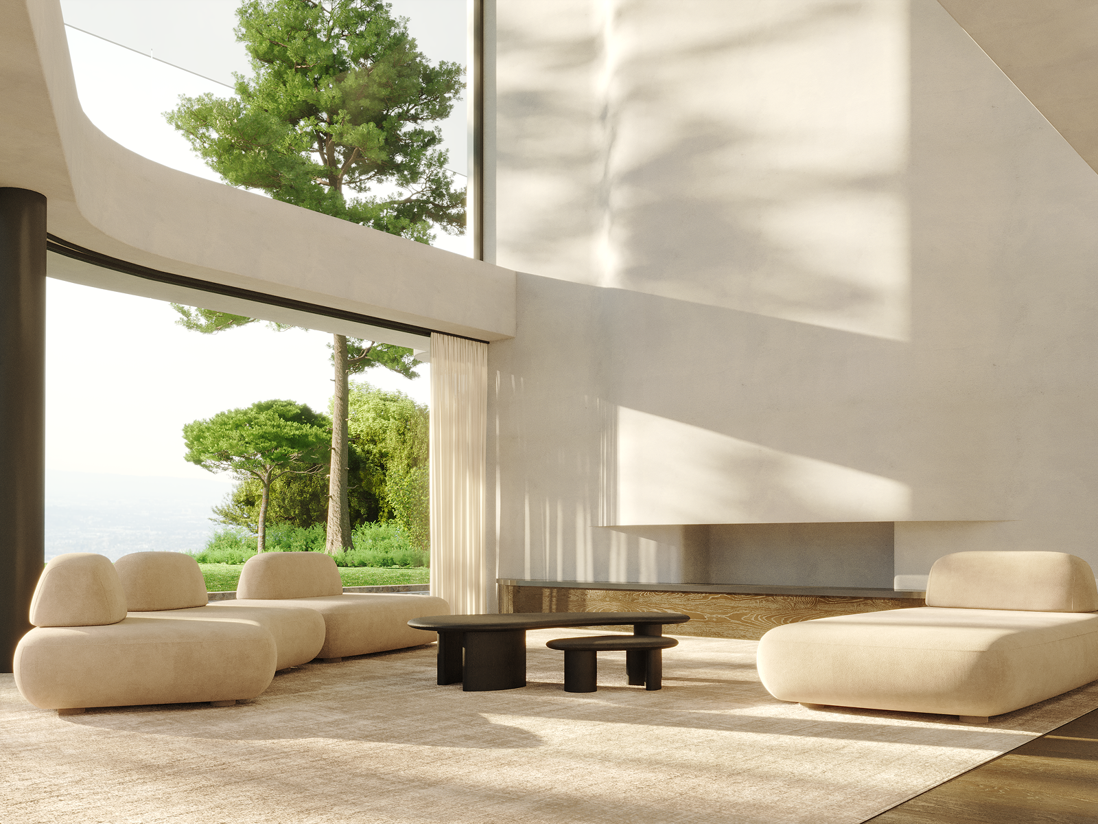 Modern living room with beige rounded couches, black coffee tables, large windows with views of trees and greenery, and natural light casting shadows on the walls.