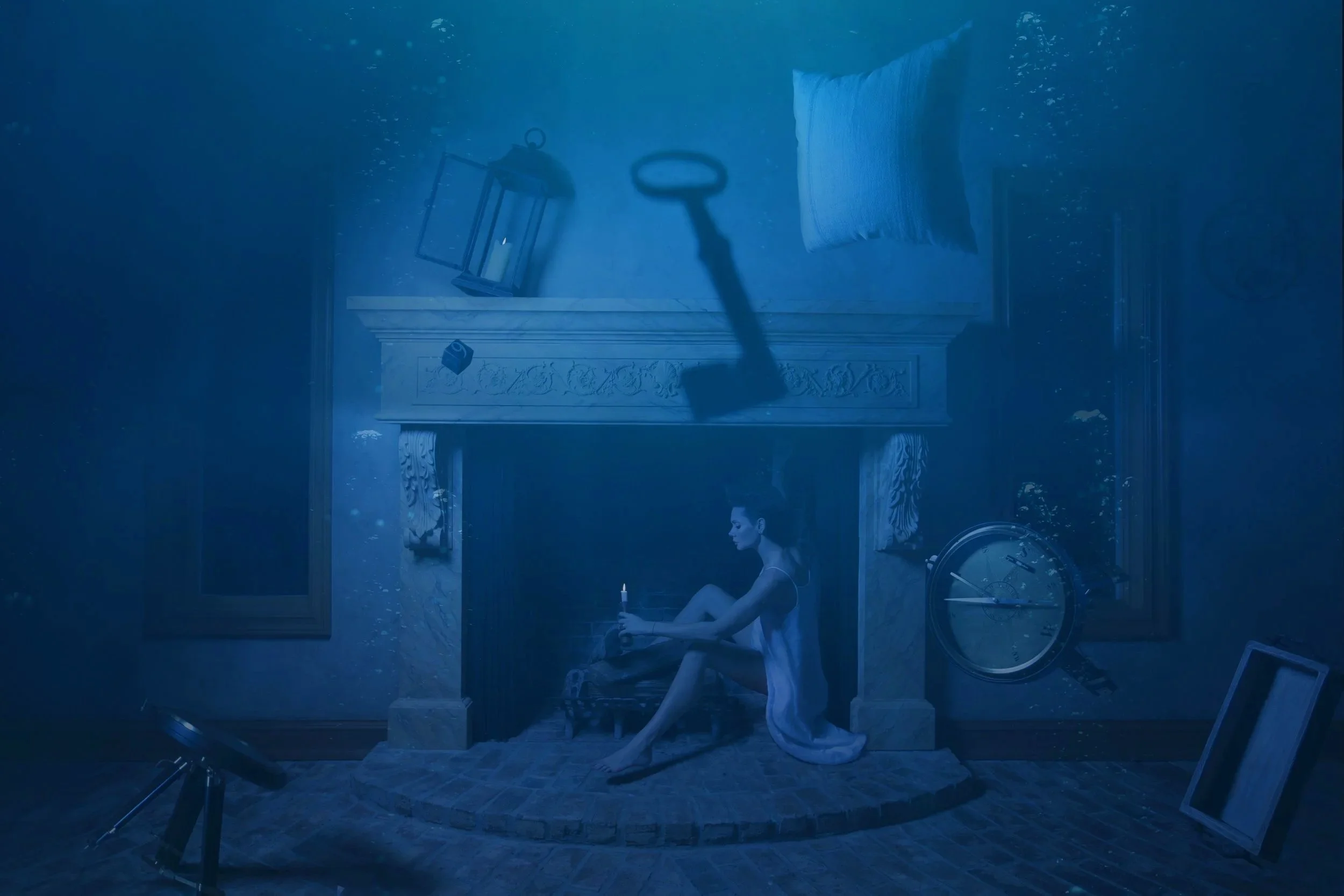 Figure holding a lit candle underwater inside a fireplace, from the Climate Change photography series by Veronica Mainetti